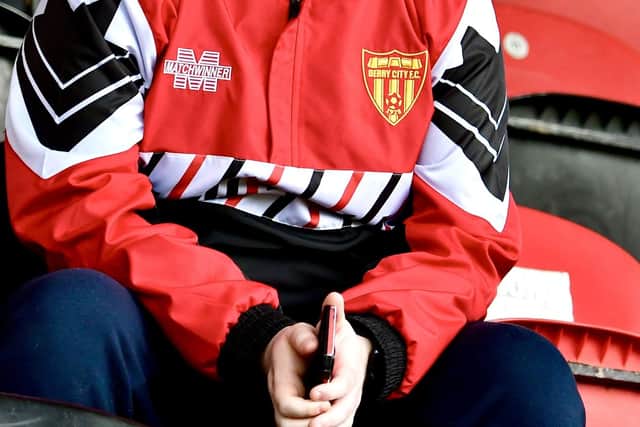 This young Derry fan, wearing the team's retro Matchwinner jacket, can't wait for kick-off.