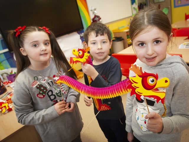 Jade, Jaydn and Beth showing off some of their artwork during last week’s visit by the Chinese Confucius Group to Steelstown PS.