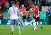 Derry City's Ciaran Coll calmly brings the ball out from the back against Shelbourne, in the Extra.ie FAI Cup Final.