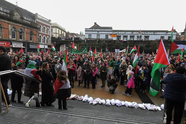 Protestors placed dolls in pillowcases, symbolising the thousands of Palestinian children recently killed in Gaza, at Guildhall steps in Derry during a previous protest rally. Photo: George Sweeney