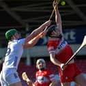 Derry’s Meehaul McGrath gets the sliothar ahead of Kildare’s Paul Dolan. Photo:  George Sweeney