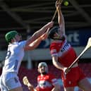 Derry’s Meehaul McGrath gets the sliothar ahead of Kildare’s Paul Dolan. Photo:  George Sweeney