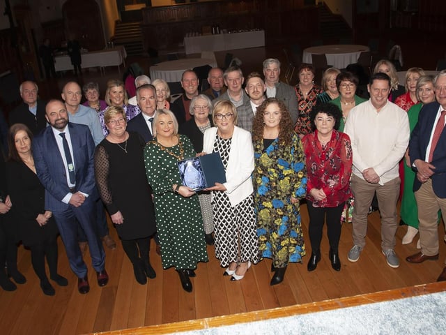 The Mayor, Sandra Duffy making a special presentation to former Hollybush PS Principal Carmel Dunn on her retirement from the school and to mark her overall contribution to education at a function in her honour at the Guildhall on Wednesday evening. Included are family, friends and former board of governors, teaching and ancillary staff from Hollybush Primary School.