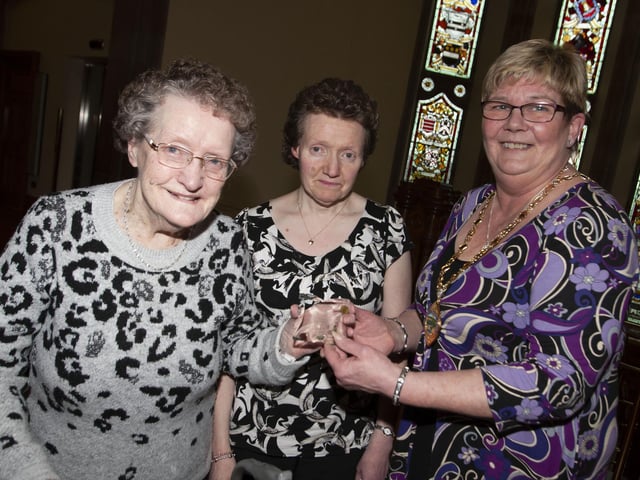 HAPPY 88th!. . . .Deputy Mayor Angela Dobbins makes a presentation to Mrs Margaret McCarter who celebrates her 88th birthday in the coming weeks, during Wednesday’s Tea Dance in the Guildhall. Centre is Margaret’s daughter Loren.