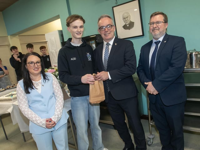 Aaron O'Dooherty, Head Boy pictured making a special presentation to Mr. Tony McGonigle, Head of KS5 on Thursday night. Included in photo is Mrs. Caroline McLaughlin, Principal and Mr. John Johnston, Vice Principal. (Photos; Jim McCafferty Photography) : .