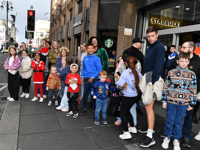 Families await the arrival of Santa at the Richmond Shopping Centre on Saturday morning. Photo: George Sweeney