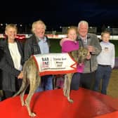 Gizmo Cash who won the Bar One Racing Crystal Vase SS0 325 yards at Lifford. From left, Michael Connors and son Paddy. At front, Lorraine Sams, John McGee and Bailey McGee being presented with the Crystal Vase from Paul Lawrence. Included on right is Jerry Connors.

=
