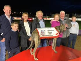 Gizmo Cash who won the Bar One Racing Crystal Vase SS0 325 yards at Lifford. From left, Michael Connors and son Paddy. At front, Lorraine Sams, John McGee and Bailey McGee being presented with the Crystal Vase from Paul Lawrence. Included on right is Jerry Connors.

=