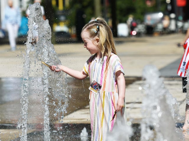 Little Orlaith Sparkes enjoying the fountains at Guildhall Square.