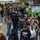 CANTERBURY, ENGLAND - MARCH 16: Staff and students, some wearing face masks, queue to receive antibiotics. (Photo by Carl Court/Getty Images)