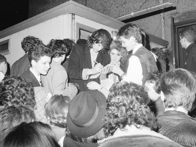 Mike Scott of The Waterboys signing autographs for fans.