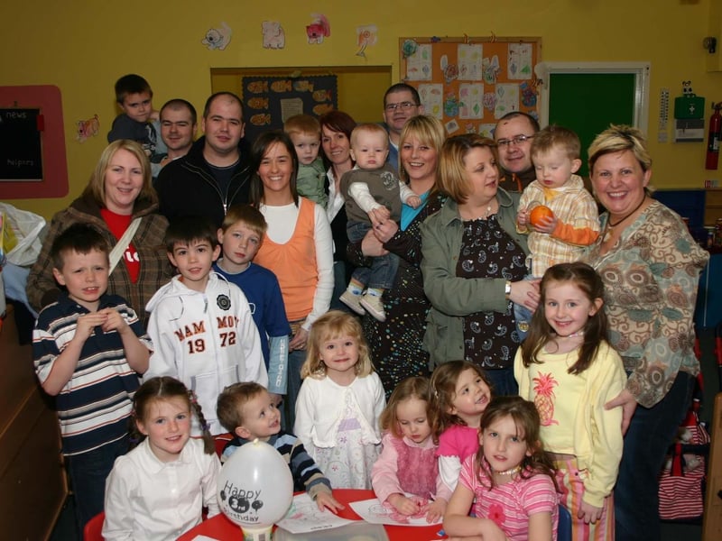 Birthday Boy Fearghal McKinney second on front row has a smile for all his friends at his third birthday party 5066dd : Parties and celebrations in Derry in April 2005.