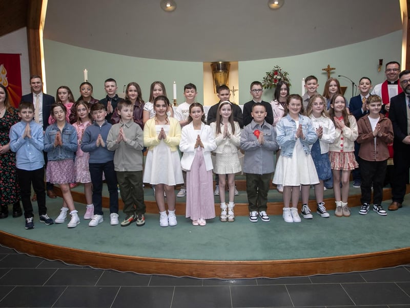 Mr. McKiverigan's Y7JK class from Sacred Heart PS, who received the Sacrament of Confirmation from Fr. Patrick Lagan at the Church of the Immaculate Conception, Trench Road, Waterside last Thursday.. Included in photo is Miss Niamh Hughes and Mr. Brendan Kelly, Classroom Assistants.. (Photo: Jim McCafferty Photography)