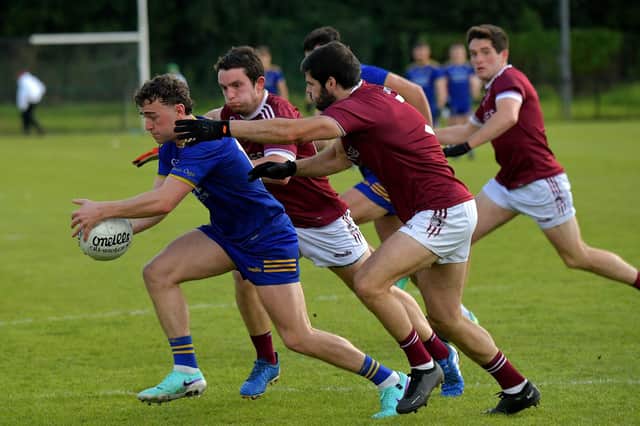 Cahir McMonagle of Steelstown is hounded by Slaughtneil players during Saturday's senior championship game. Photo: George Sweeney. DER2331GS – 86