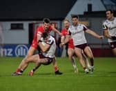 Derry’s Anton Tohill contests possession with Galway’s Matthew Tierney. Photo: George Sweeney