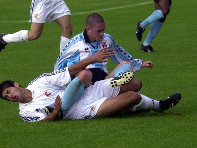 Tommy McCallion puts in a strong tackle.