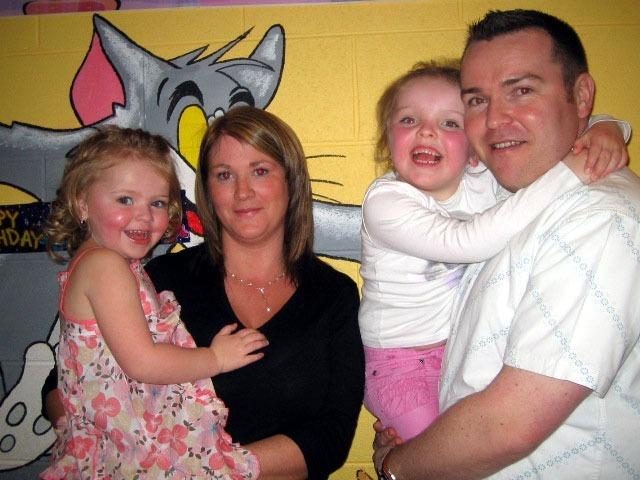 Zoe pictured with her mum Elaine, dad Matt and sister Hannah on the occasion of her 3rd birthday 0082JML : Parties in Derry in Spring 2006.