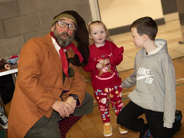 Borris The Elf gets a photo with little Jo and her brother Sean Og : .