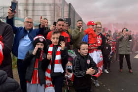 Fans gather at Brandywell Stadium the Saturday morning before the FAI Cup Final to give wish Derry City players and coaches good luck as they depart for Dublin to face Shelbourne. Picture by George Sweeney