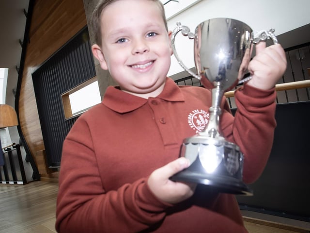Eli Gillespie proudly smiles with his trophy. : Foyle School of Speech and Drama's fantastic annual charity feis for the Foyle Hospice