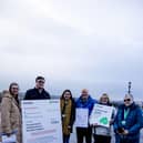 Charity staff and food bank volunteers present Stormont with an invoice for the cost of inaction on child poverty