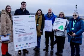 Charity staff and food bank volunteers present Stormont with an invoice for the cost of inaction on child poverty