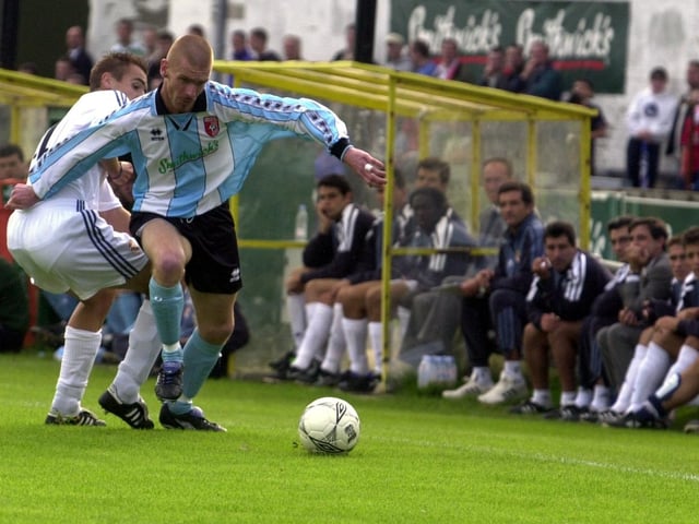Jamie Hughes attacks down the left wing.