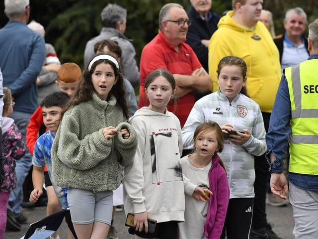 Spectators at the Muff Feile opening parade makes on Friday evening. Photo: George Sweeney