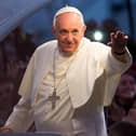 RIO DE JANEIRO, BRAZIL - JULY 26:  Pope Francis waves from the Popemobile on his way to attend the Via Crucis on Copacabana Beach during World Youth Day celebrations on July 26, 2013 in Rio de Janeiro, Brazil. More than 1.5 million pilgrims are expected to join the pontiff for his visit to the Catholic Church's World Youth Day celebrations which is running July 23-28. (Photo by Buda Mendes/Getty Images)