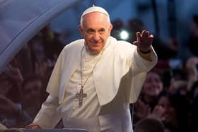 RIO DE JANEIRO, BRAZIL - JULY 26:  Pope Francis waves from the Popemobile on his way to attend the Via Crucis on Copacabana Beach during World Youth Day celebrations on July 26, 2013 in Rio de Janeiro, Brazil. More than 1.5 million pilgrims are expected to join the pontiff for his visit to the Catholic Church's World Youth Day celebrations which is running July 23-28. (Photo by Buda Mendes/Getty Images)