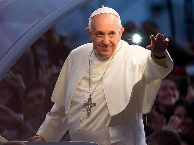 RIO DE JANEIRO, BRAZIL - JULY 26:  Pope Francis waves from the Popemobile on his way to attend the Via Crucis on Copacabana Beach during World Youth Day celebrations on July 26, 2013 in Rio de Janeiro, Brazil. More than 1.5 million pilgrims are expected to join the pontiff for his visit to the Catholic Church's World Youth Day celebrations which is running July 23-28. (Photo by Buda Mendes/Getty Images)