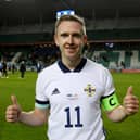 Shane Ferguson pictured after winning his 50th cap for Northern Ireland has been linked with a move to Derry City.