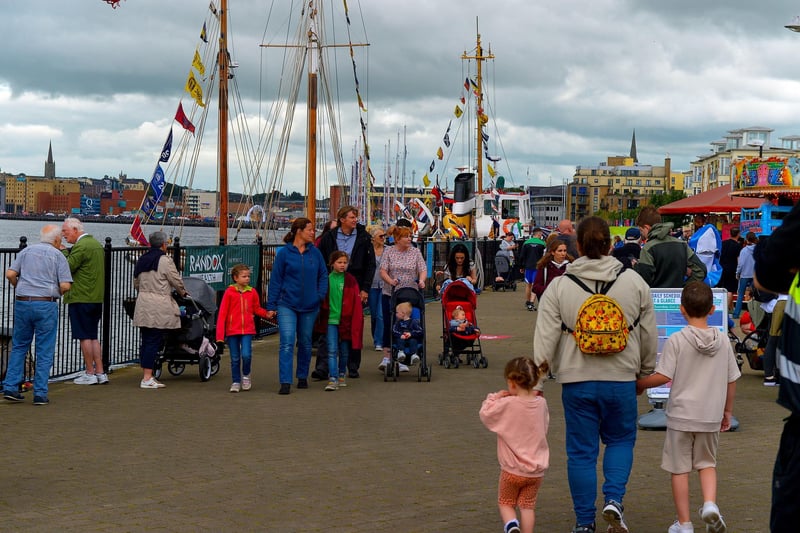 People stroll along Queen’s Quay during the Foyle Maritime Festival. Photo: George Sweeney. DER2229GS – 051