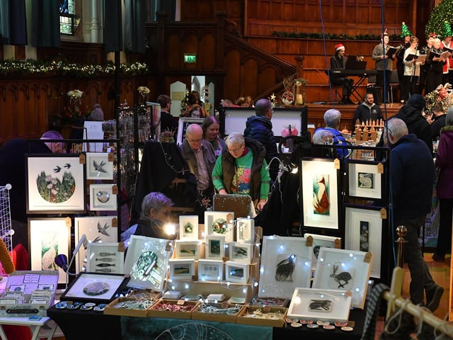 People browse the large range of gifts at the Guildhall Christmas Fair on Friday afternoon. Photo: George Sweeney / Derry Journal