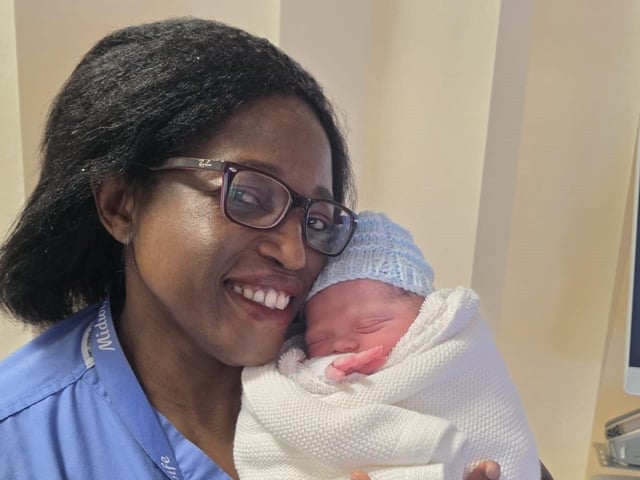 Baby boy of Selina Moore and Patrick Connor from Limavadypictured with Midwife Mavis Kachimba. Born on January 1 at Altnagelvin Hospital at 11:07am weighing 6lbs 5oz.