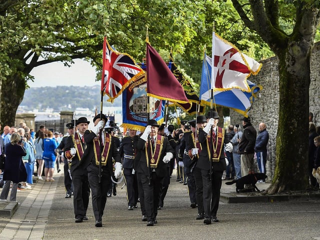 The Associated Clubs ABOD General Committee lead a parade around Derry’s Walls on Saturday morning. Photo: George Sweeney