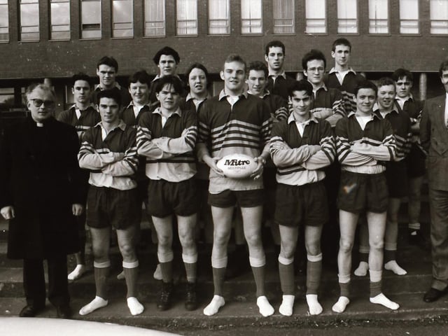 St Columb's College Rugby XV with coach and science teacher MR Mellon and principal Fr Walsh.