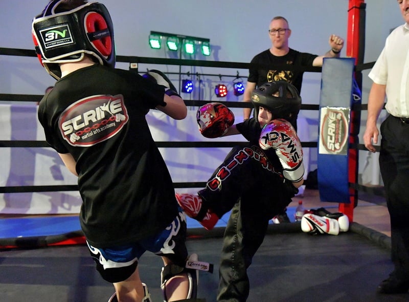 Cian Sharkey (on the right), from Strike Martial Arts, takes on Cabel McCann from Full Circle Martial Arts in The Rising Stars event held in Shantallow Community Centre on Saturday.Photo: George Sweeney. DER2308GS – 144