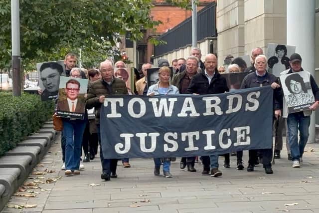 The families of James Wray and William McKinney and supporters arrive at Belfast Crown Court for the trial. (Rebecca Black/PA)
