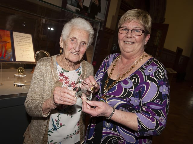HAPPY 99th!. . . .Deputy Mayor Angela Dobbins makes a presentation to Mrs. Margaret Roberts who celebrates her 99th birthday this year, during Wednesday’s Tea Dance in the Guildhall.