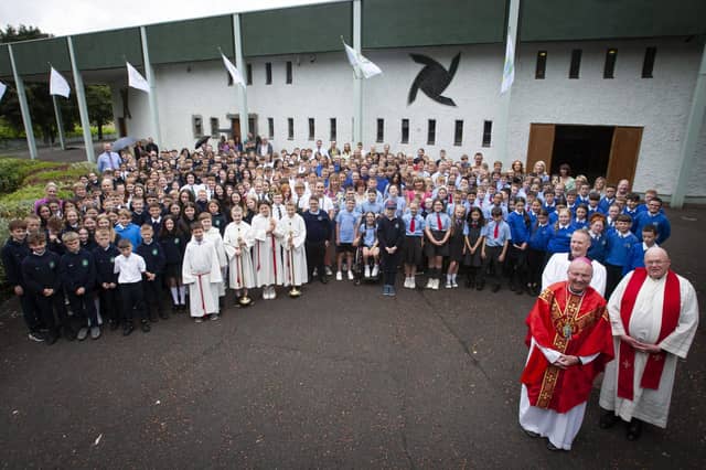 CONFIRMATION MASS OF THANKSGIVING. . . . .The Bishop of Derry Dr. Donal McKeown pictured with pupils from schools in the Three Patrons Parish who received the Sacrament of Confirmation this year, at a special Thanksgiving Mass at St. Brigid’s Church, Carnhill last week. Schools in attendance included St. Brigid’s PS, St. Paul’s PS, St. Therese PS, Greenhaw PS, St. Patrick’s PS, Pennyburn and Ardnashee School. Celebrating Mass with Bishop McKeown were Fr. McGaughey and Fr. O’Donnell. (Photos: Jim McCafferty Photography)