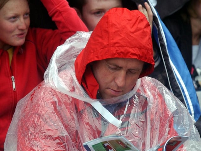 This Derry Fan came well equipped to deal with the showers at Croke Park on Sunday. (3108A23)