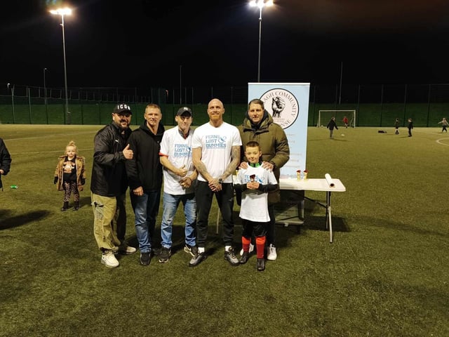 Some of the Fern Park legends, Dummies, receiving their participation trophy from Ruaidhrí Higgins.