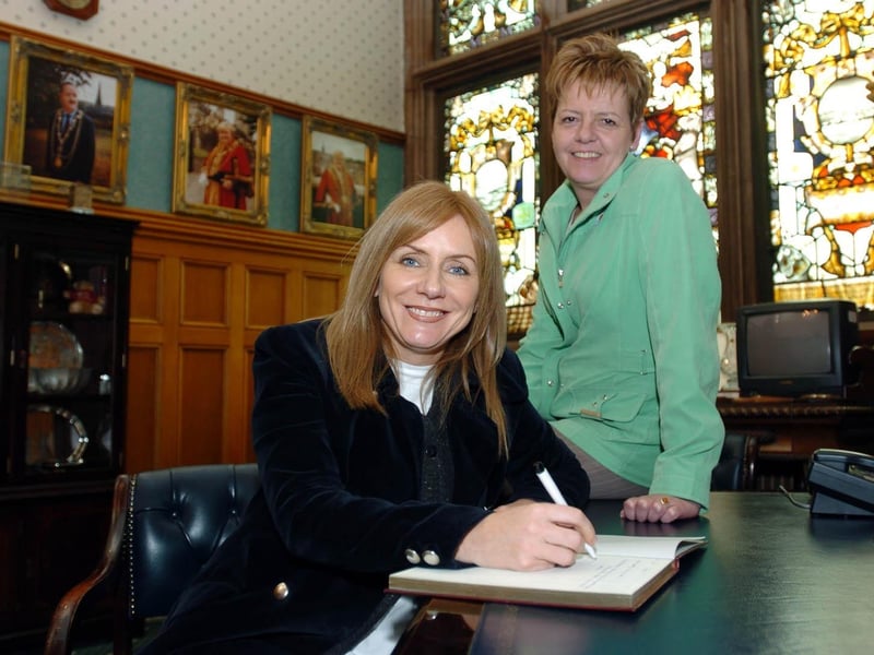 The Mayor of Derry, Councillor Lynn Fleming, pictured with Irish Musician, Frances Black as she signs the visitors book at the Guildhall. : St Patrick's Day in Derry in 2006.