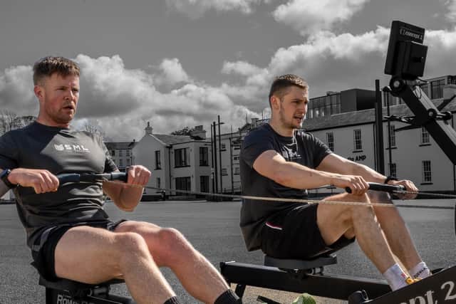 Ebrington Hyrox organiser Sean McLaughlin testing out the rower at Ebrington with Sean Noble.