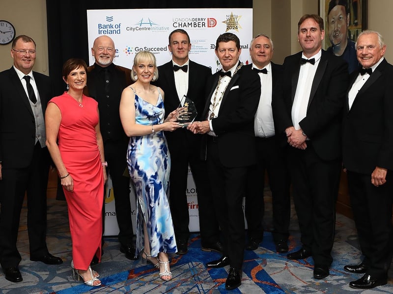 Stephen Gillespie, Director of Business and Culture at Derry City & Strabane District Council presenting Translink with the Sustainability Champions Award.