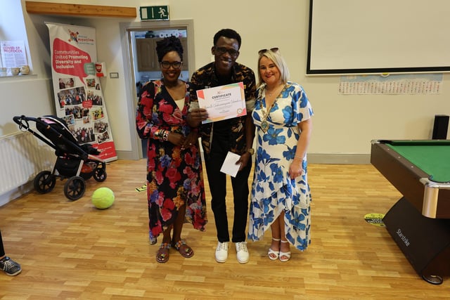 Kenneth Odumukwu picking up his certificate from Lilian Seenoi Barr and Mayor Sandra Duffy.