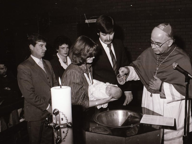 Bishop Daly with newly baptised infants at Holy Family Church during pastoral visitation to Ballymagroarty.