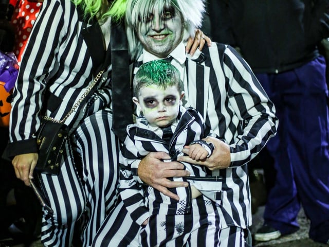 Derry Halloween Carnival Parade & Fireworks Display. Beetlejuice family enjoying the parade. Credit © Lorcan Doherty