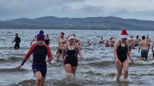 Christmas Day dippers at the annual swim at Ludden beach, Buncrana, County Donegal.